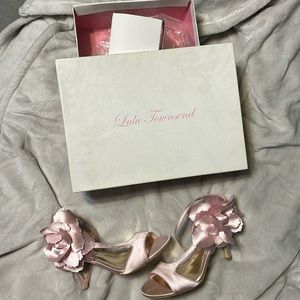 Gorgeous pink satin pumps with rosettes